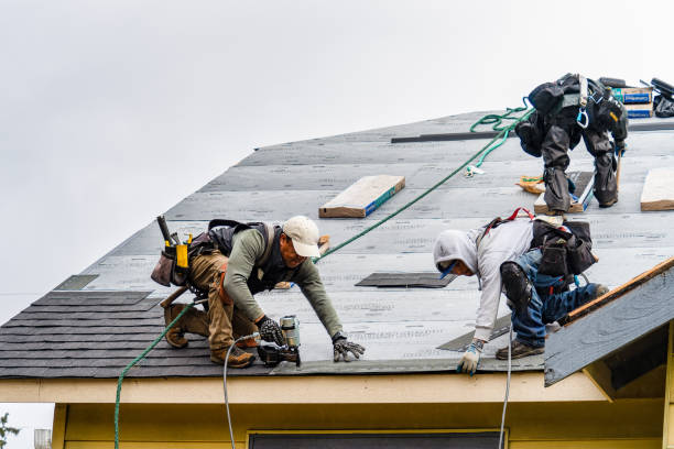 Professional Roofing technician working in Oakland, ME